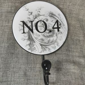 Hat Or Jacket Hanger With The Number 4 On It 9" x